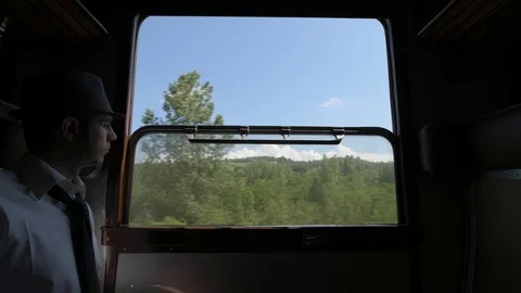 4K young man in vintage train car looking sad and lonesome Stock Footage 90813622