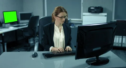 4K: A young manager is working very concentrated at her desk. Stock Footage 66547554