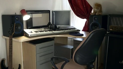 4K Young Musician Composing, Playing and Recording Music on Computer Workstation Stock Footage 107005646