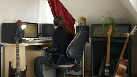 4K Young Musician Composing, Playing and Recording Music on Computer Workstation Stock Footage 107005982
