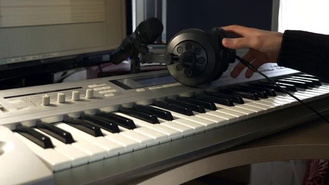 4K Young Musician Composing, Playing and Recording Music on Computer Workstation Stock Footage 107006368