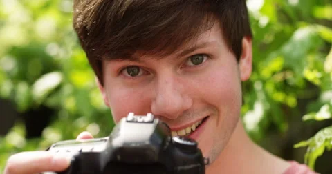 4k, young photographer takes a photo with his digital camera. Slow motion. Stock Footage