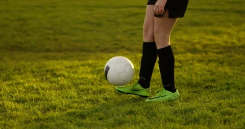 4K Young soccer player showing dedication &amp; practicing with football Stock Footage 86321682