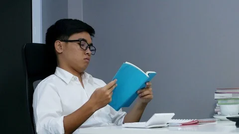 4k of young student reading a book Stock Footage 93400470