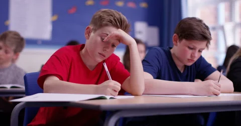 4k, A young student struggling during a class test. Slow motion. Stock Footage