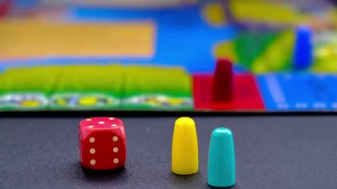 4k zoom in out Dice for board games on black background. Board game with multi Vidéo 217686859