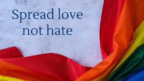 4k zoom in out Rainbow flag with text SPREAD LOVE NOT HATE message. Rainbow Stock Footage 225653531