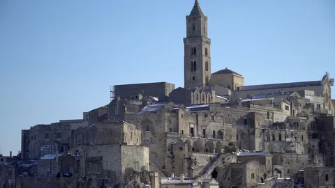 4k Zoom out shot of Sassi di Matera in Italy covered by snow during winter Stock Footage 89779119