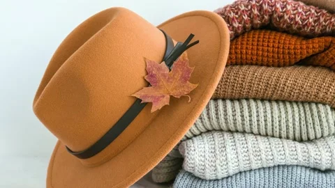 4k zoom in out Stack of cozy knitted warm sweater with Autumn fall maple leaf Stock Footage 228405426
