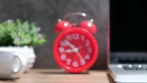 4k zoom in shot of red clock on business desk. Stock Footage 109143461
