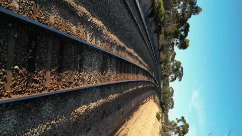 4K60 Vertical Format Train Tracks in Australia Supplying Mining Industry Stock Footage 278566783