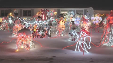 4K60fps Christmas string lights adorn the front yard of this home's decorations Stock Footage 151167963