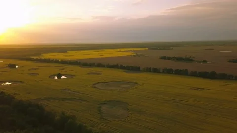 4k.Aerial. Landscape with fields and beautiful  color sky  in sunset time 库存影片 90489642