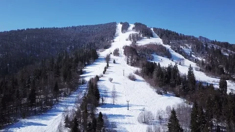 4k.Aerial. Mountain with  alpine skiing elevator. Winter time Stockbeeldmateriaal 86912268