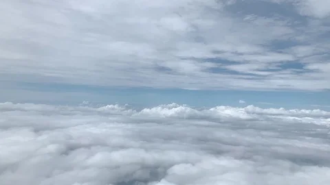 4k.cloudscape.a lot of clouds view from window of flying airplane Video stock 122926205