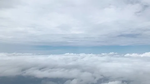 4k.cloudscape.a lot of clouds view from window of flying airplane Stock Footage 122926303