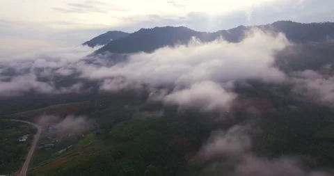 4k,Drone fly over the clouds in rain forest at southern of Thailand Stock Footage 138757124