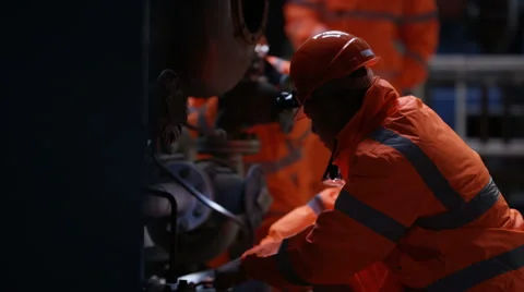 4KEngineering team carrying out maintenance in power plant with foreman watching Stock Footage