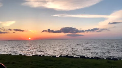 4K,real time, Sea sunset with dramatic cloud in the sky 스톡 동영상 244986064