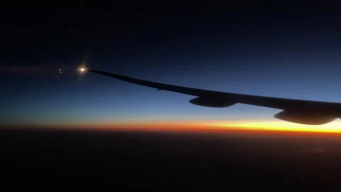 4K,real time,Flying across cloud in twilight airplane window view Video stock 244986060
