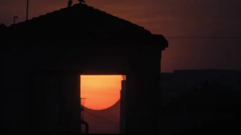 4ksun set big sun long lanes behind building cinematic winter sun India Asia Mum Stock Footage 144860608