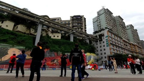 4K timelapse of a train going through building Liziba station Chongqing China Stock Footage 122664396
