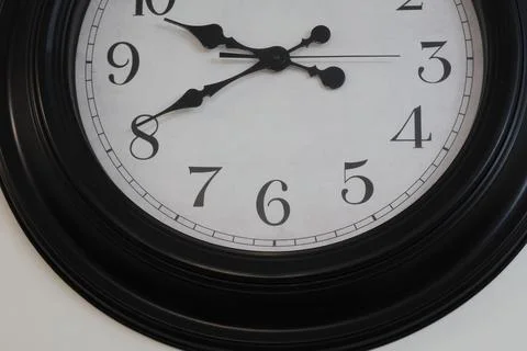 4S3A0513Close up of wall clock showing five minutes to twelve o'clock Stock Photos