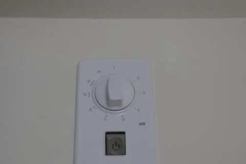 4S3A0753Electric water heater control panel on a white wall Stock Photos