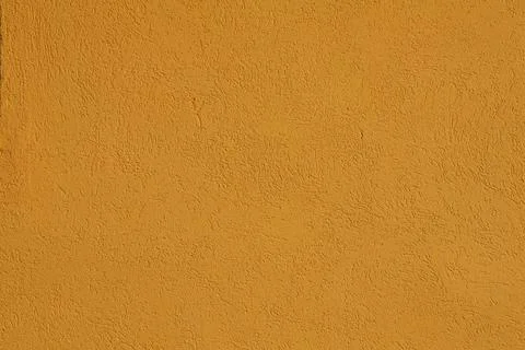 4S3A7290 Texture of old rustic orange wall covered with yellow stucco Stock Photos