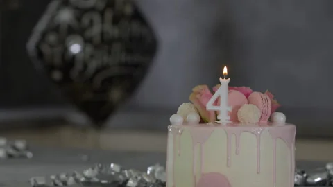 4th Birthday cake with decorations Stock Footage 249985428