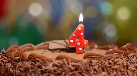 4th birthday candle on cake Stock Footage 40107016