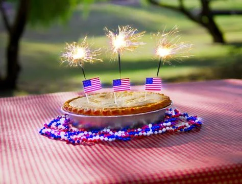 4th of July Apple Pie with Sparklers on a Table Stock Photos