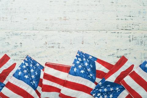 4th of July background. US flag paper napkin and picnic cocktail straws on ol Stock Photos