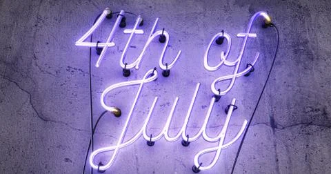 4th of July Independence Day bright blue neon sign on a grey concrete backgro Stock Illustration