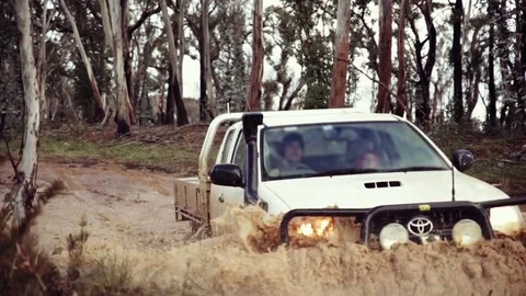 4wd SUV utility driving through muddy water Stock Footage 82519571