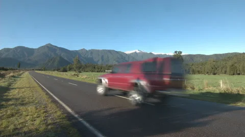 4x4 Car Drives along empty Road in New Zealand Stock Footage 63917726
