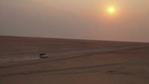 4x4 Driving Across Remote Desert Road in Namibia at Sunset Stock Footage 339501811