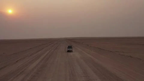 4x4 Driving Along Endless Desert Road at Sunset in Namibia Stock Footage 339501943