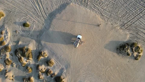 4x4 driving on the Beach by Sunset Stock Footage 276594207