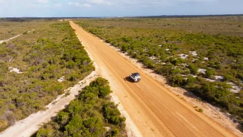 A 4x4 driving full speed on an Australian road, filmed with a drone Stock Footage 345852759
