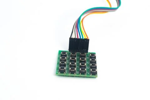 A 4x4 keypad module with a rainbow cable behind it. This module is used for e Stock Photos