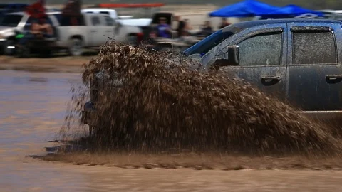 4x4 Pickup Splashing Through Mud - Shallow Depth of Field Stock Footage 107074449