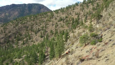 4X4 Pulling Trailer Down Mountain Road Drone Shot Stock Footage 146553181