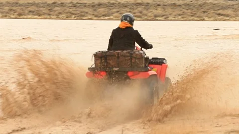 4x4 Quads Splashing Through Mud - Shallow Depth of Field Stock Footage 107074428