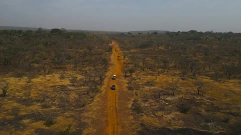 4x4 Off-Road Convoy Driving Through African Savanna Drone Shot Front View Stock Footage 341620880