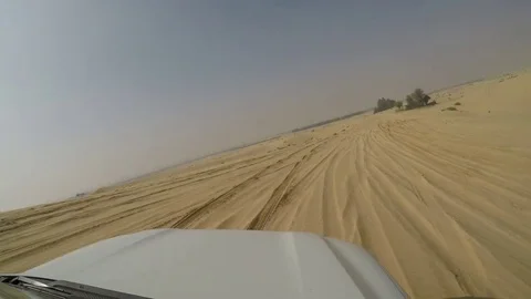 4x4 SUV car driving through the sand dunes in the desert of abu dhabi time lapse Stock Footage 73180333