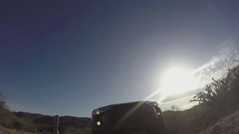 4x4 SUV drives over POV camera in Arizona desert Stock Footage 78492453