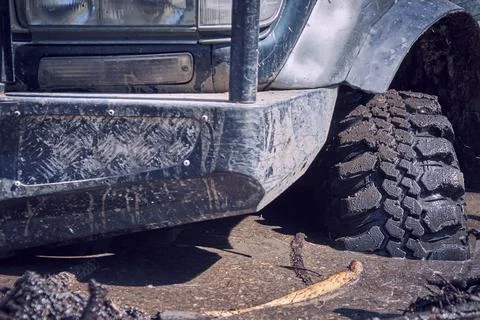 The 4x4 SUV is stuck in the mud. Stock Photos