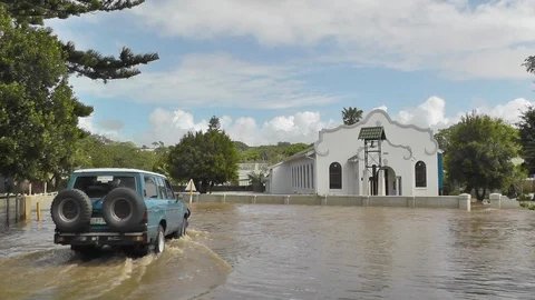 4x4 Vehicle crossing a Flooded Intersection in South Africa Video stock 89245349