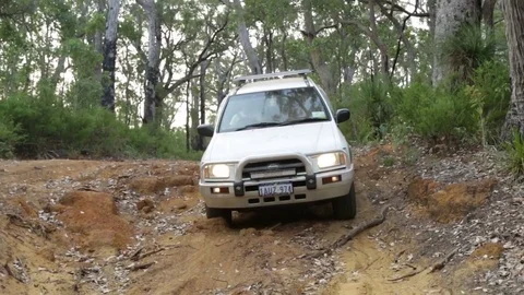 4x4 Vehicle driving down a rock ledge Stock Footage 72184397
